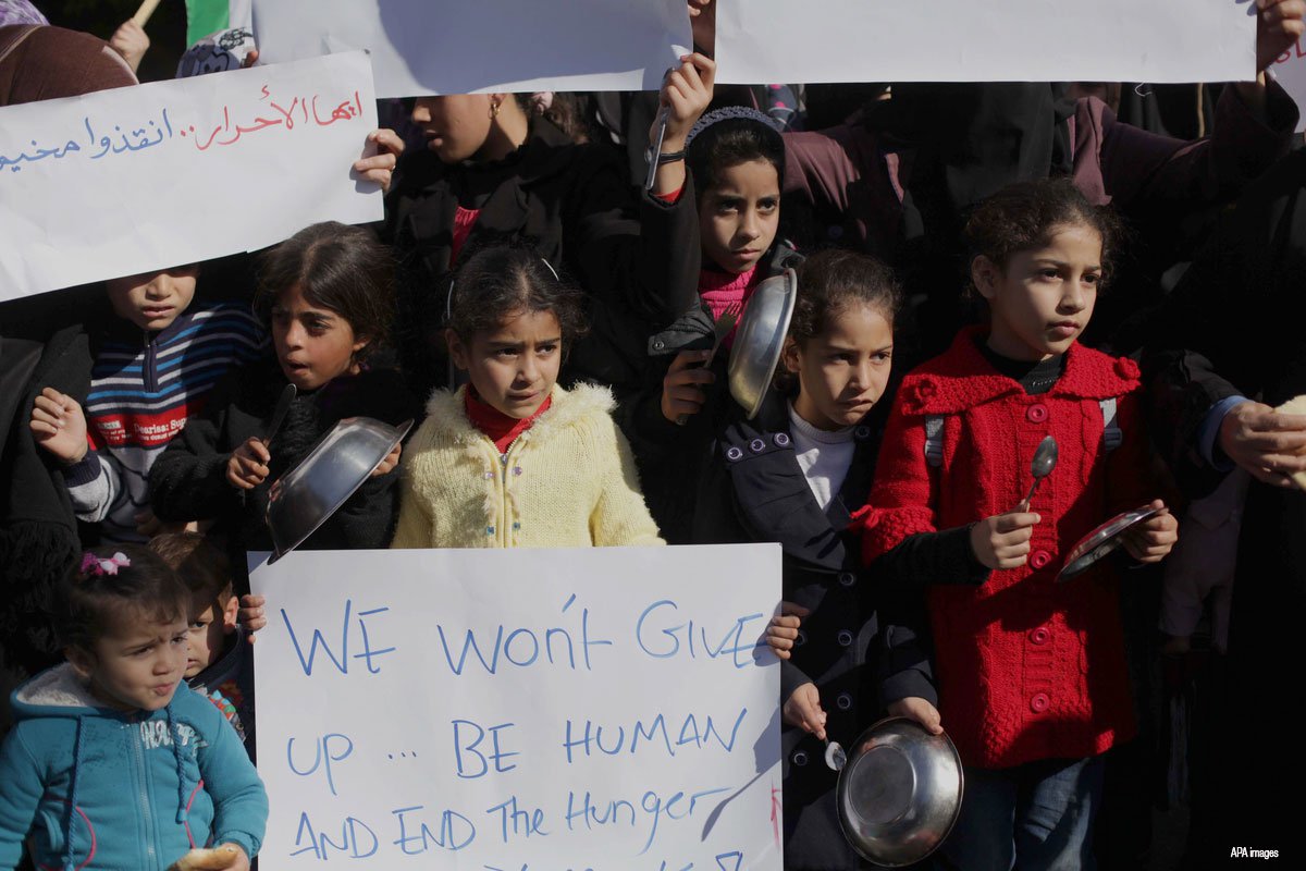 Palestinian-children-gather-to-show-solidarity-with-Palestinian-refugees-in-Syrias-refugee-camp-Yarmuk